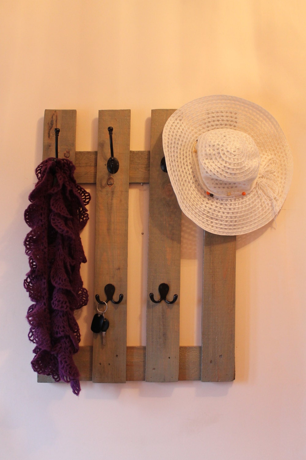 Rustic large coat rack made of recycled pallet wood, black metal hooks, drift gray stain handmade