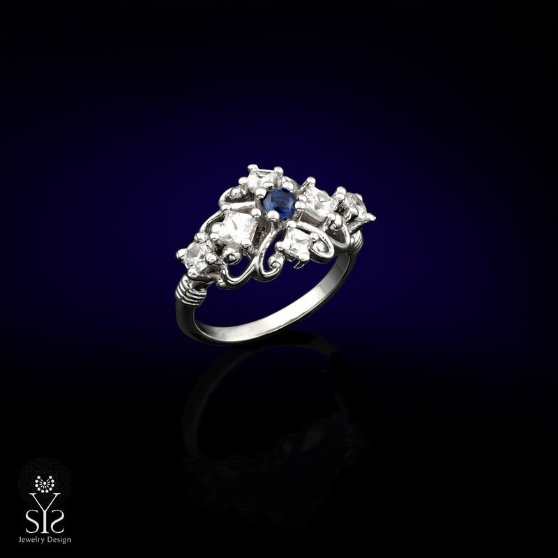 Vintage style 14k white gold engagement ring with genuine round cut natural blue Sapphire and diamonds.