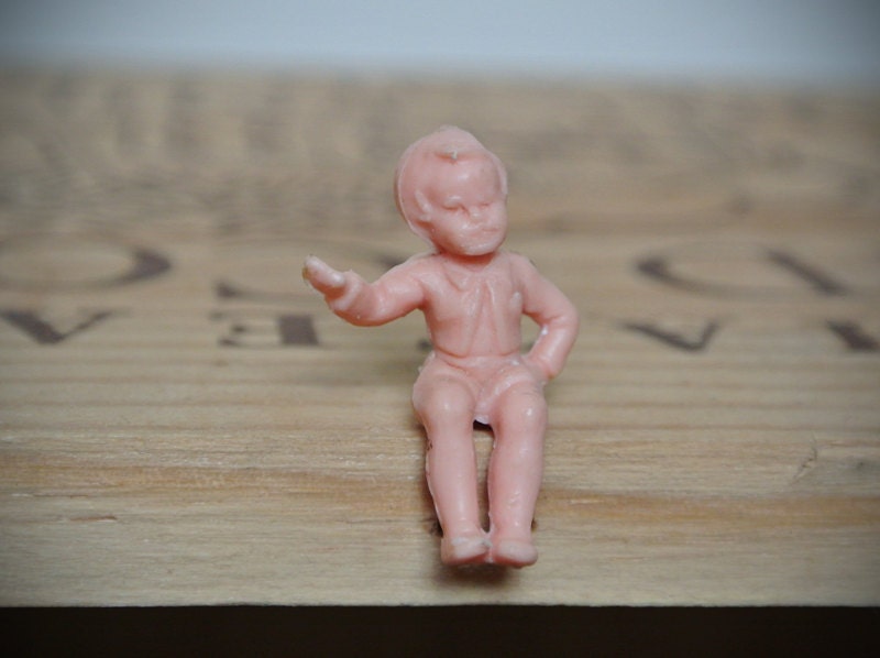 Tiny Pink Plastic Sitting Boy Figure featured image