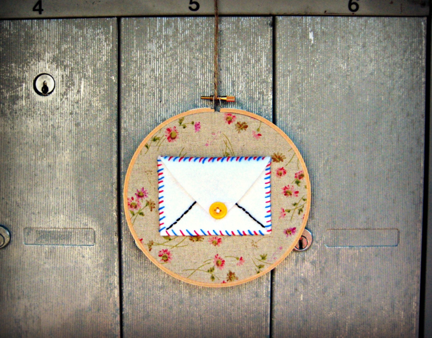 EMBROIDERED AIRMAIL ENVELOPE - Decorative textile wall art with a message pocket on floral lambswool colored linen.