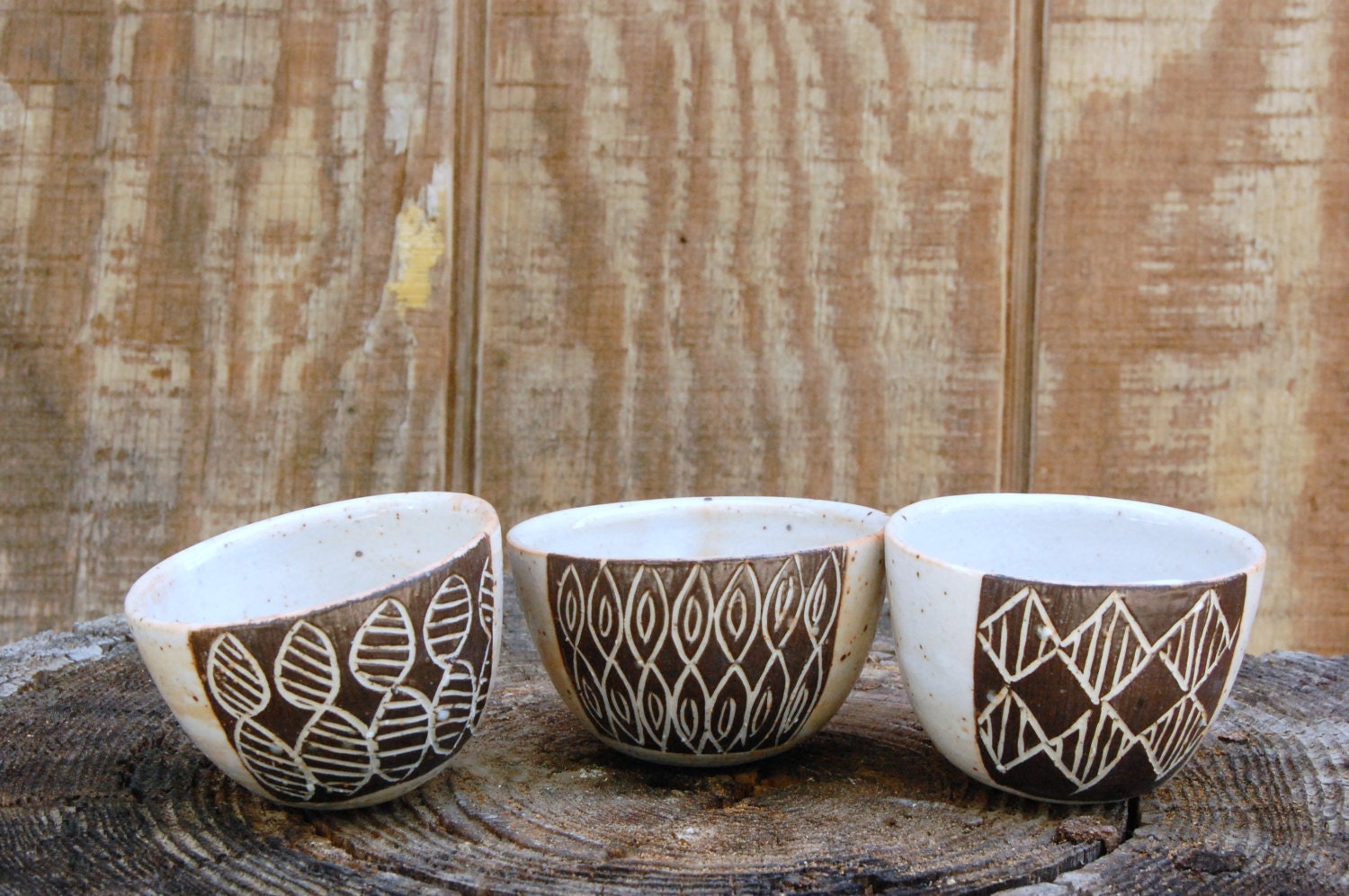 set of 3 black and white carved little wobble bowls
