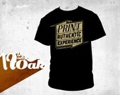An original 17th and Oak 'Print is an Authentic Experience' screen printed black t-shirt with metallic gold print