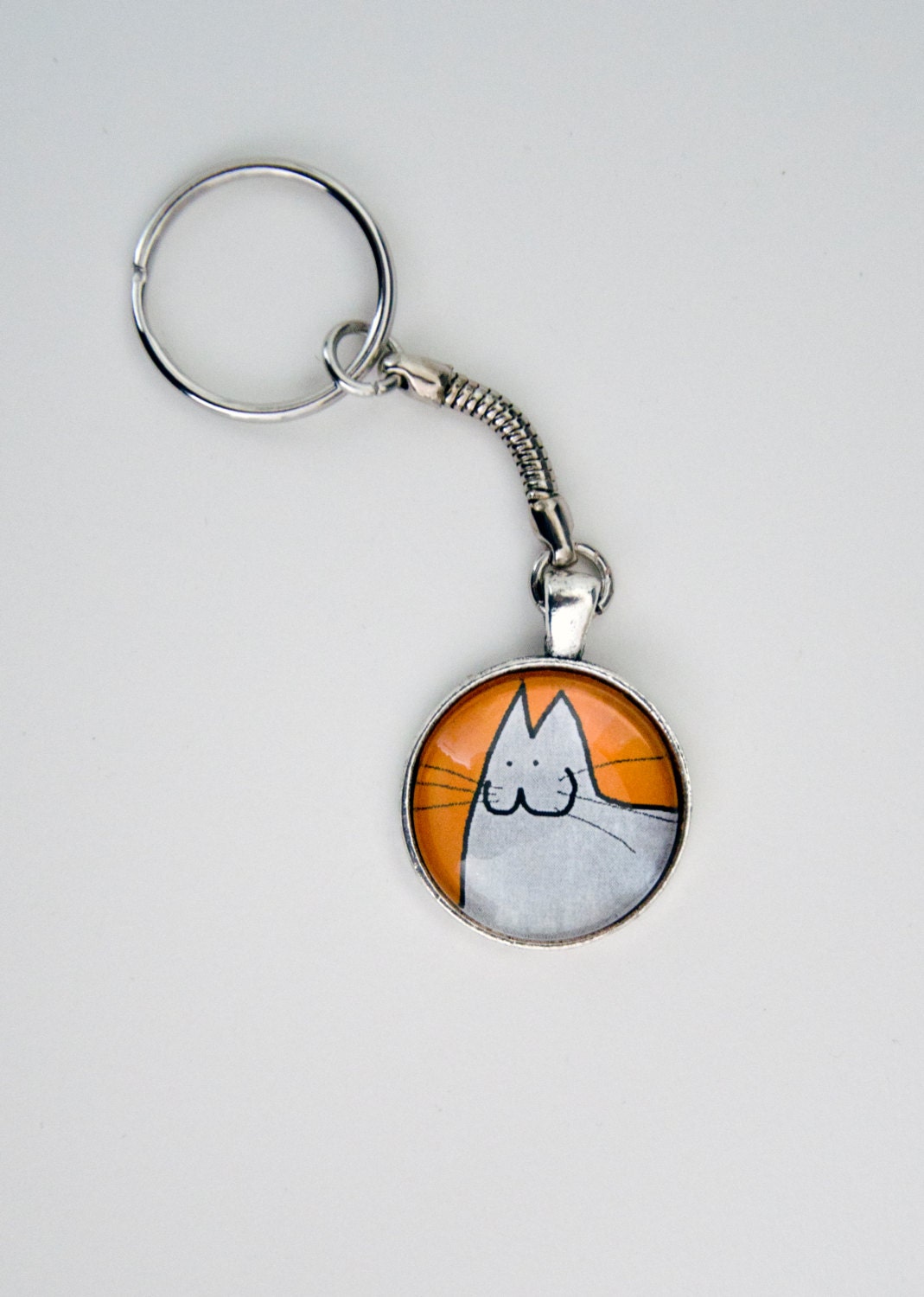 Spread Happiness with the Happy Cat, 12 different colors - Round Pendant on a Keyring