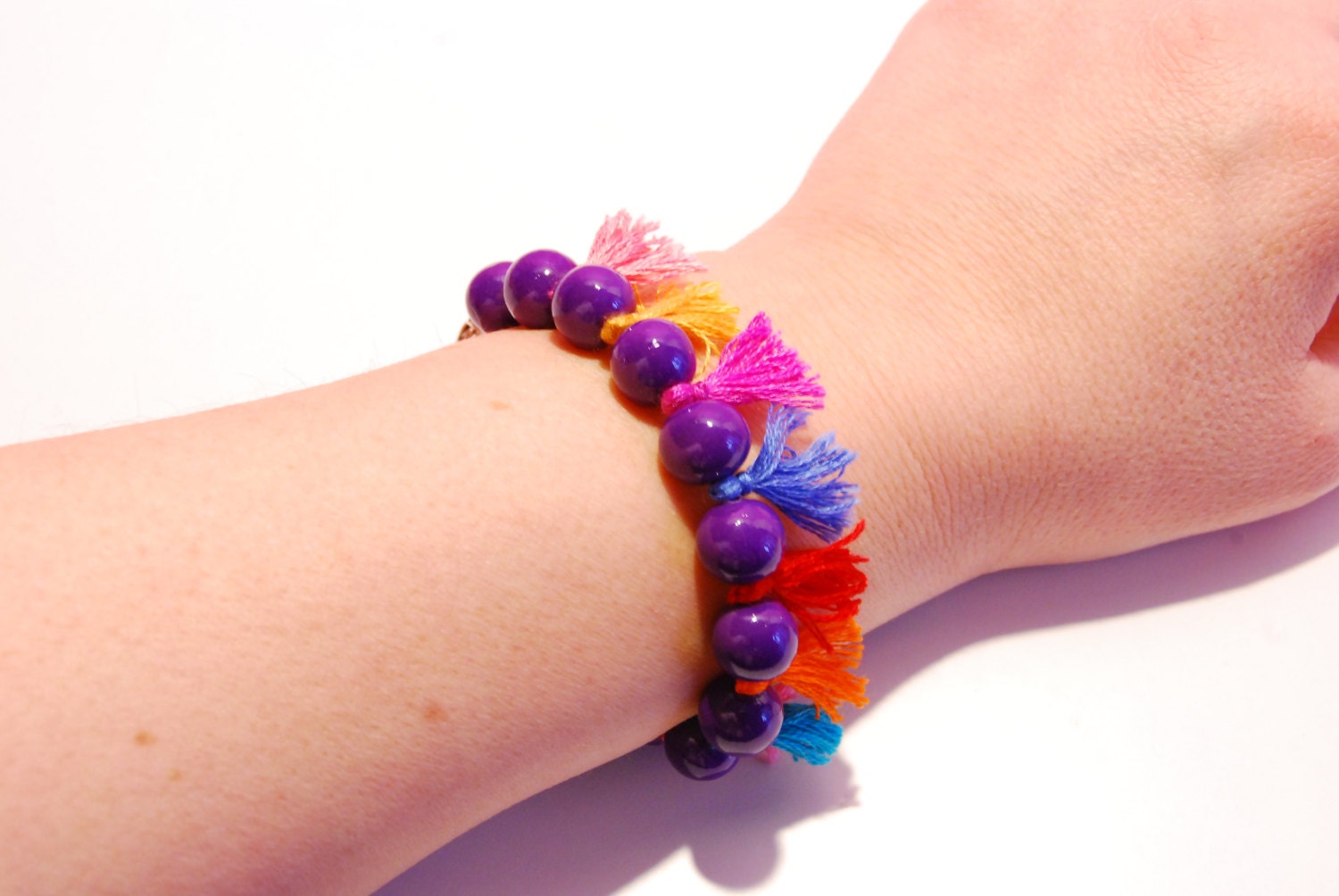 Special mauve playful bracelet from handmade polymer clay beads and colorful tuft