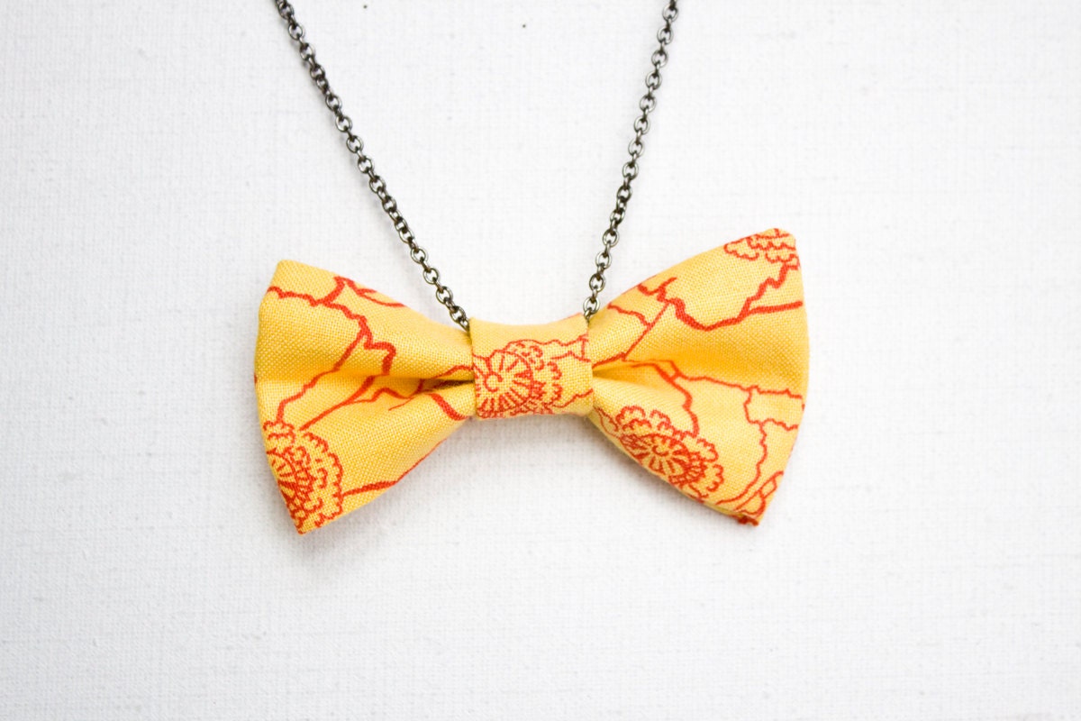 Bright Yellow Bow Tie Necklace with Red Floral Pattern