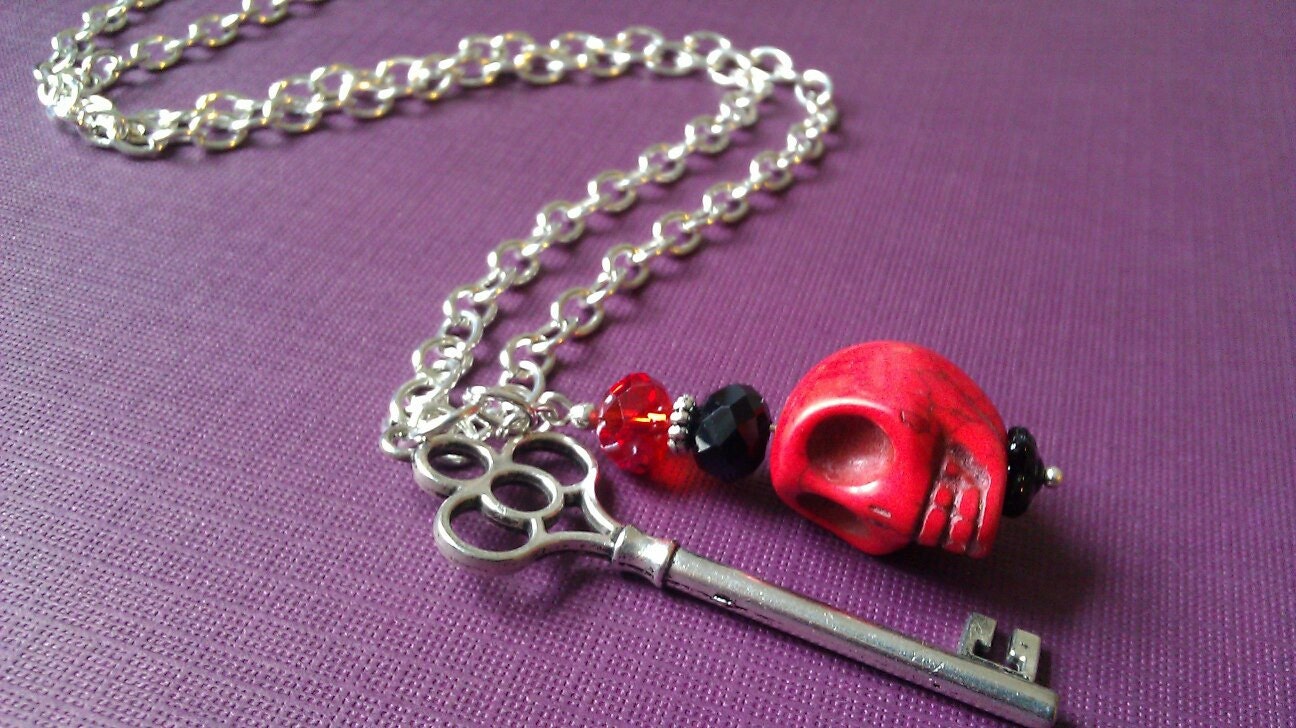 red howlite skull and crystal bead hangs with silver sketeton key from 32" silver plated chain
