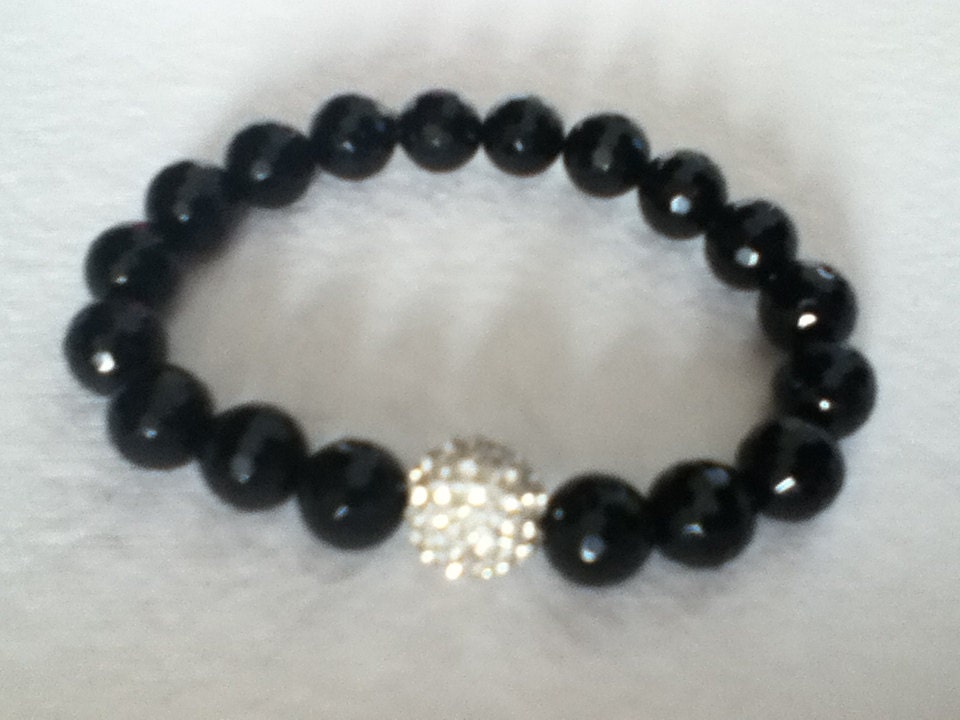 Black beads with large white Swarovaski bead