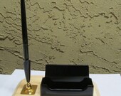 Business card holder and Sheaffer pen on wood base.