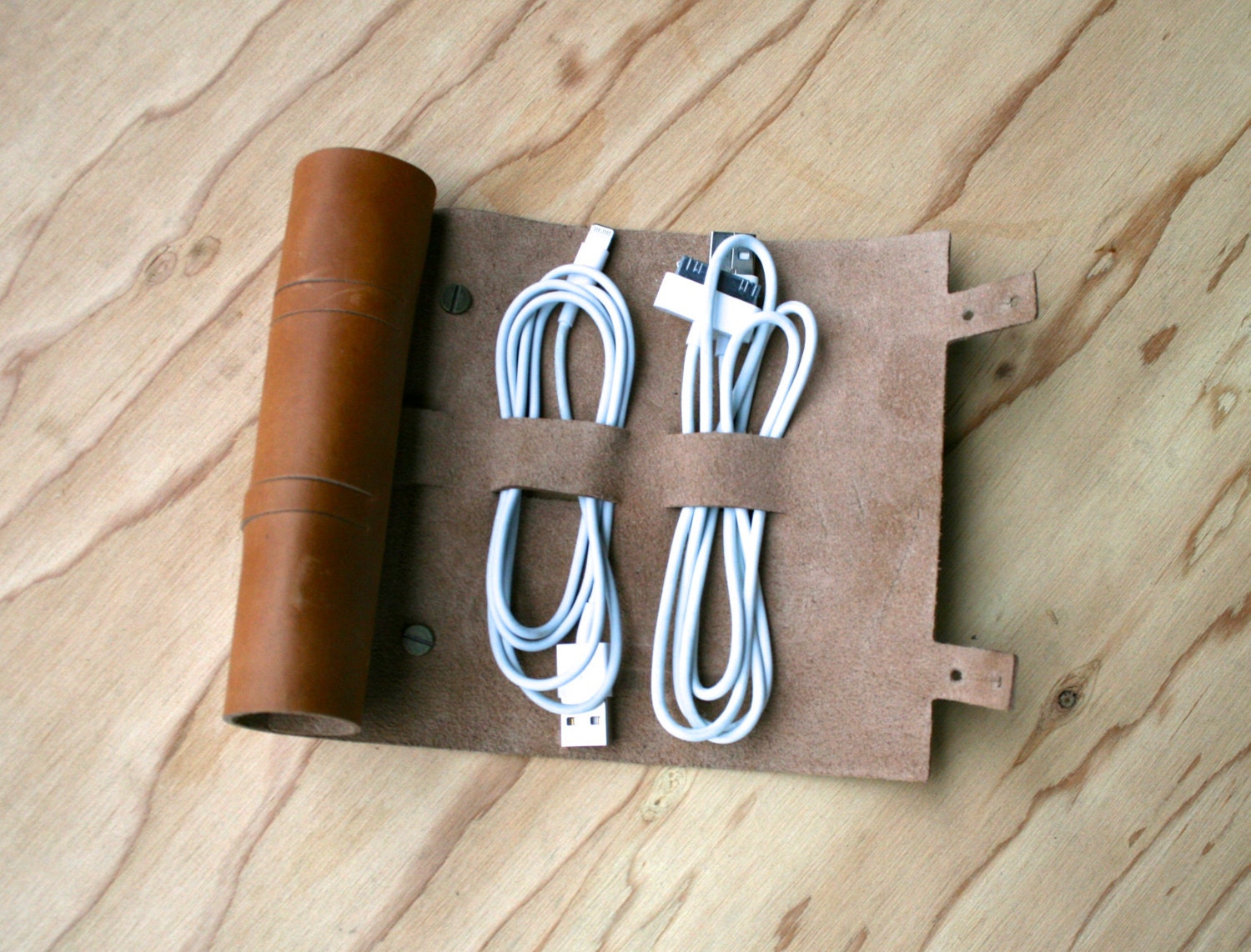 Cordito cord wrap that holds 3 cables and 2 plugs.