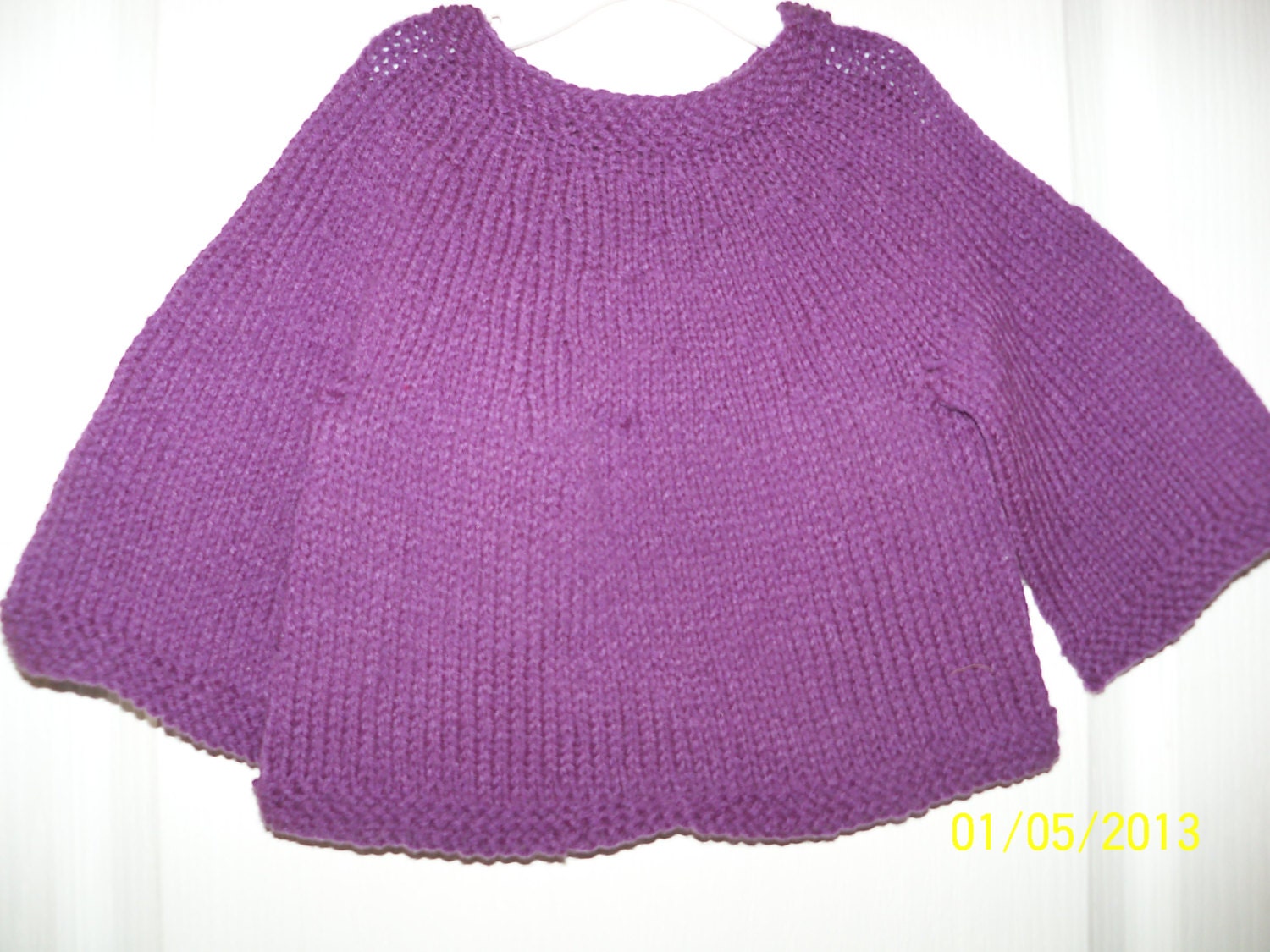 Purple round-neck tunic.