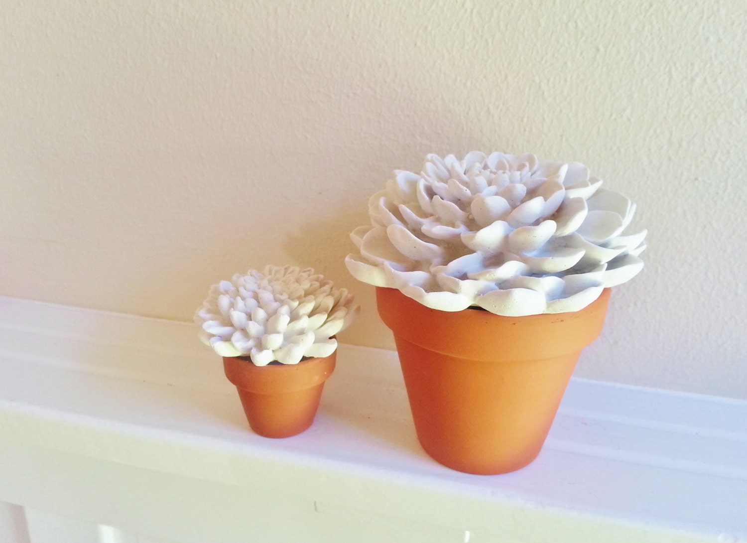 White Flower Sculptures in classic garden flower pots, Minimalist floral arrangement, modern floral