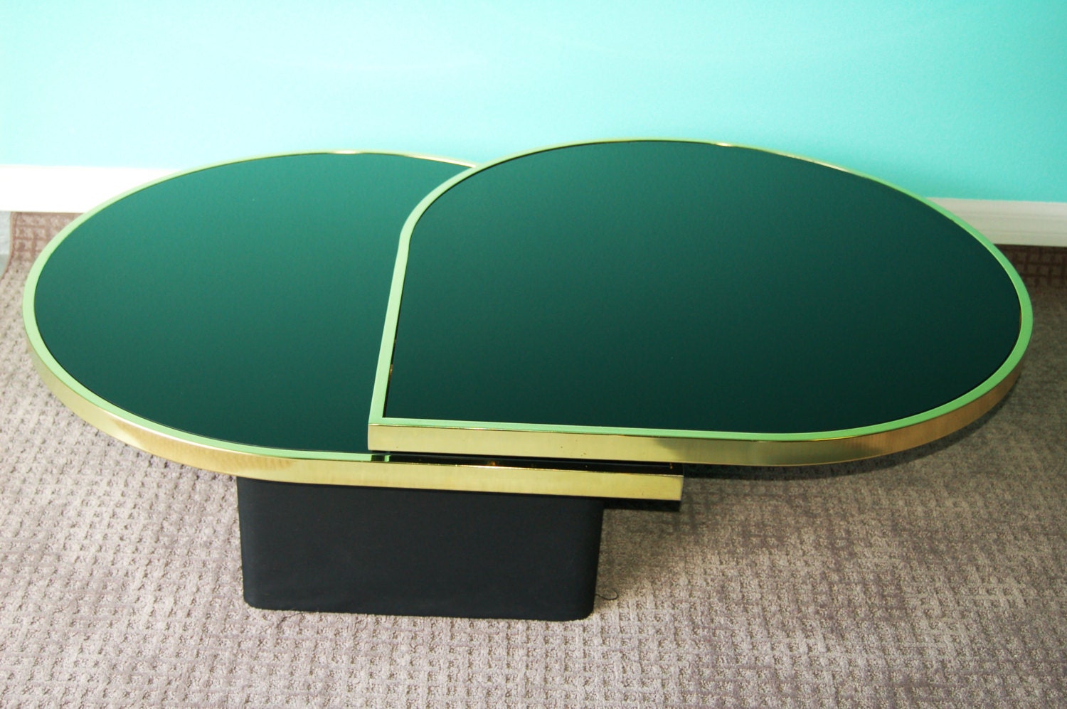 Stunning Mid Century Modern Teardrop Black Glass and Brass Swing Out Coffee Table by Design Institute of America. Vintage