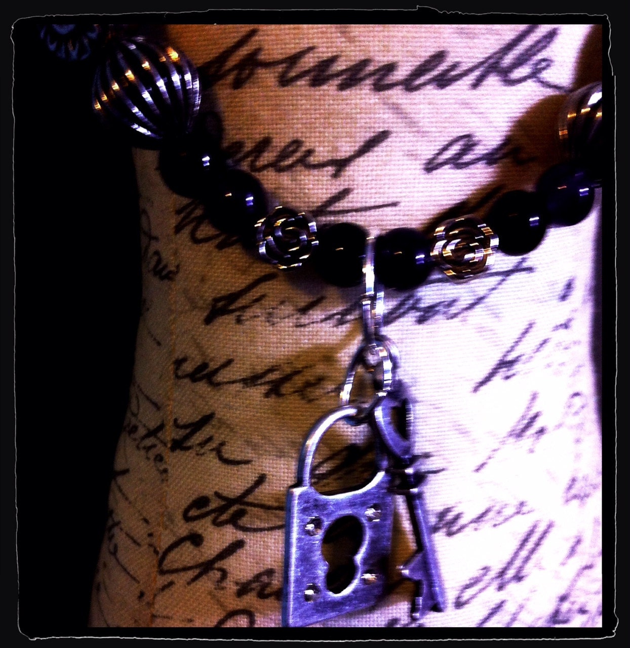 Handmade Black, Purple, and Silver toned metal beads (roses, Sun/Moon, stripes) with Key and Lock Pendant
