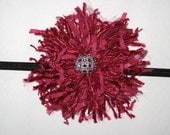 This Beautiful, Trendy, Chic and Unique fuchsia pompom with a rhinestone broach handmade headband is highly stylish for today's fashion