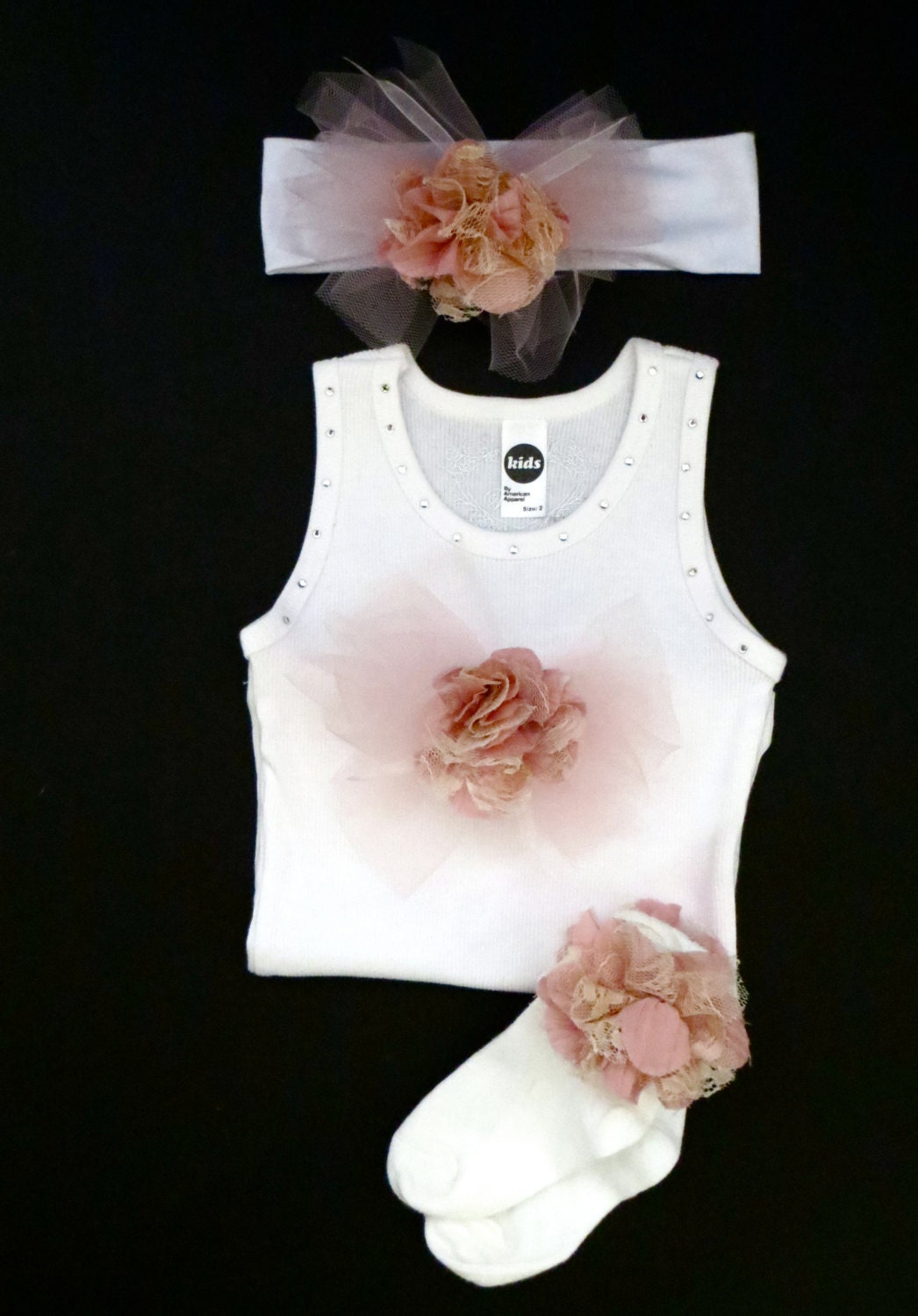 Trendy, Chic & Unique outfit detailed with a shabby chic vintage flower, tule, ribbon and rhinestones is highly stylish for today's fashion