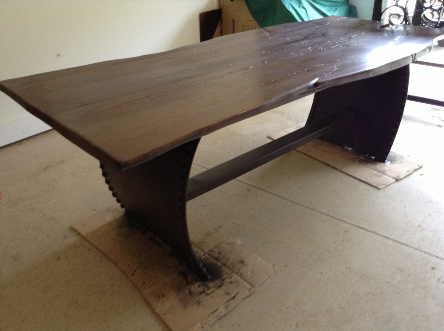 Live oak table on a riveted metal base
