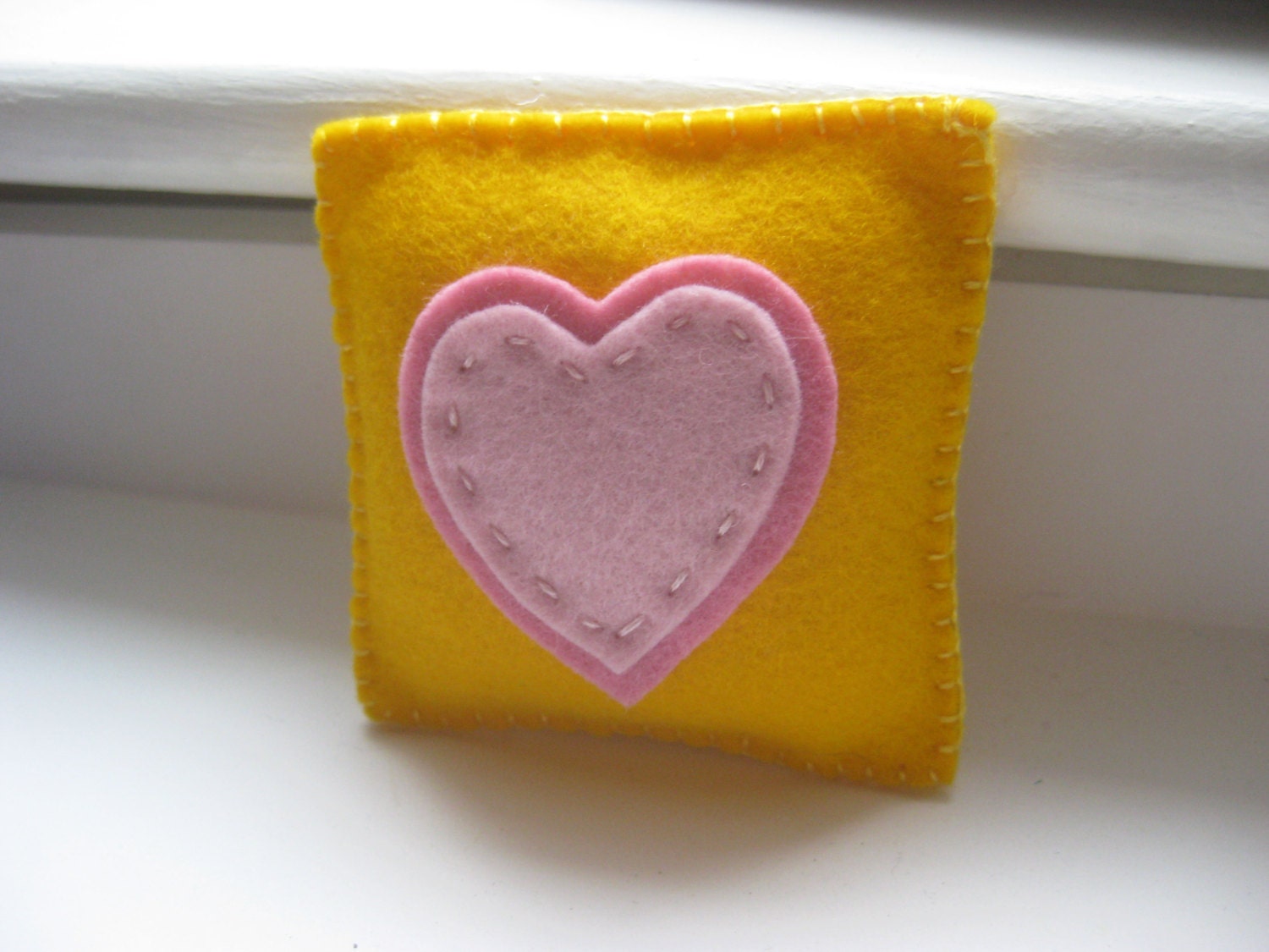 colorful felt tooth fairy pillow with hearts, in yellow and pink, custom, made to order