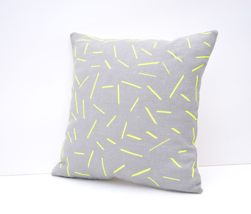 Linen pillow cover in silver gray and neon yellow sticks