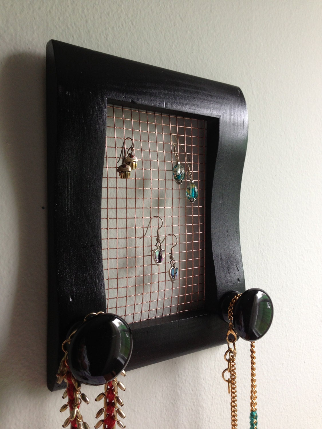 Upcycled black frame jewelry holder for necklaces, earrings, and more - black and copper with ceramic knobs