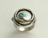 Sterling silver engagement  ring with coin pearl and a blue opal - A place under the sun.