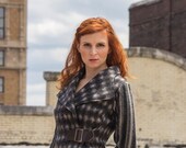Women's jacket in gray and black dot wool with multi stripe sleeves, leather belt with tortoise buckle