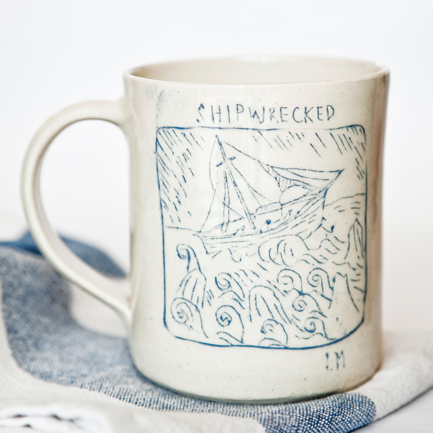 Shipwrecked/ Mercy. Slip decorated Ceramic Cup.