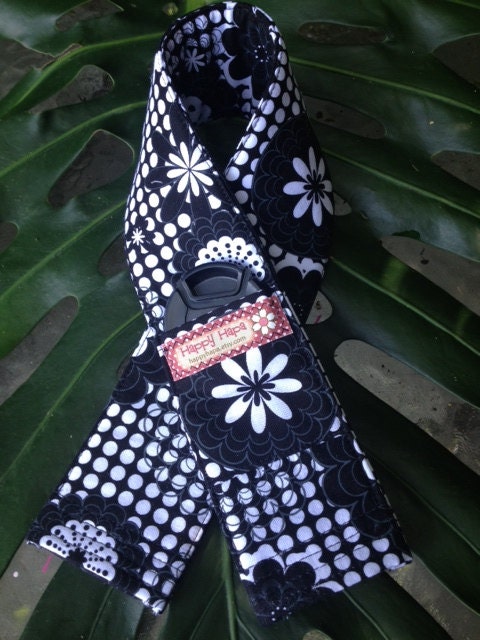 Camera Strap Cover with Lens Cap Pocket in Black and White. Floral.