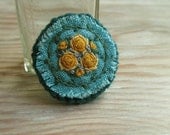 Yellow Roses Brooch Hand Embroidered on Teal Linen