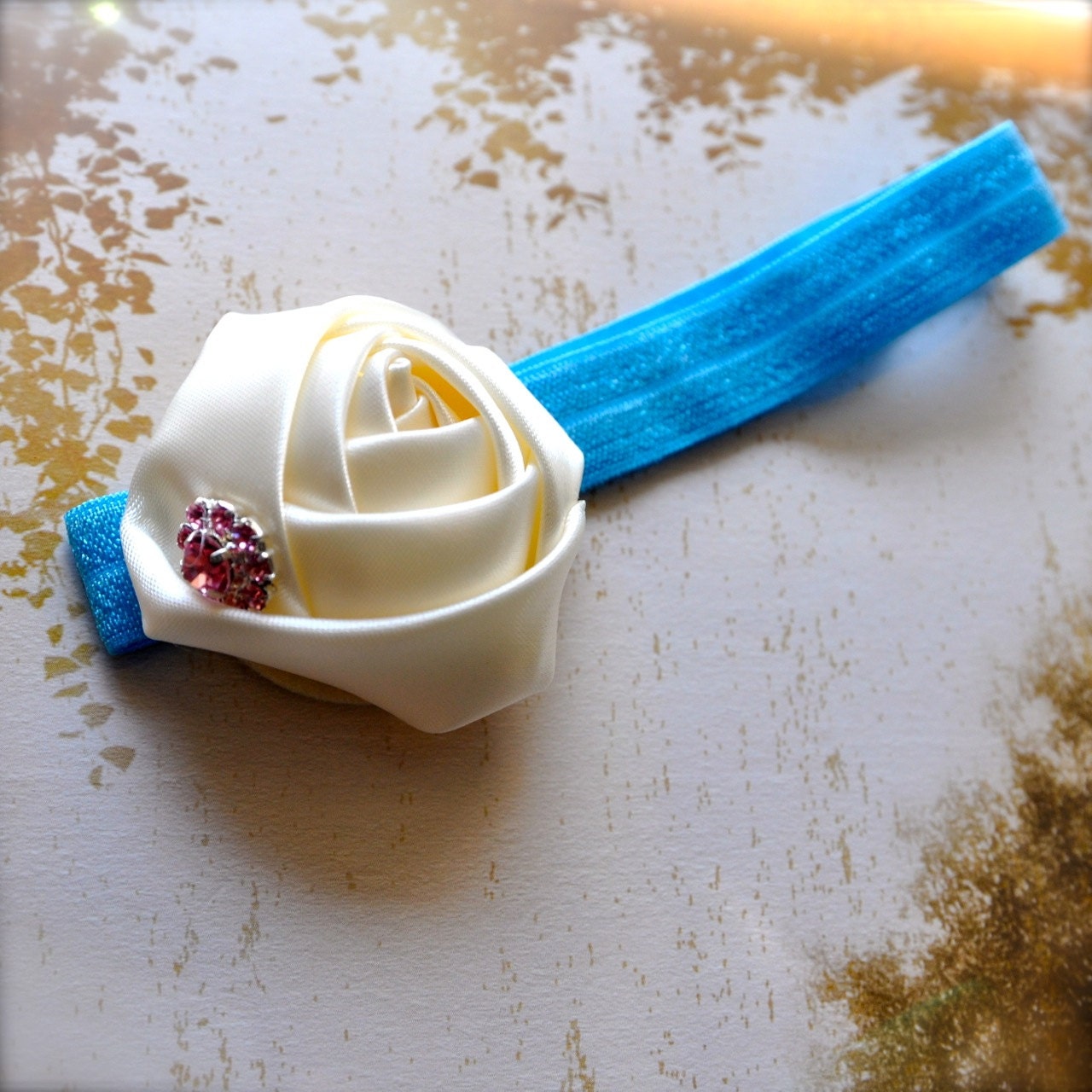 Pink or ivory satin rose jeweled headband for newborns and little girls.