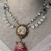 she sells seashells - vintage assemblage necklace with portrait pendant, rhinestones, and mother of pearl rosary by the french circus