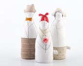 The hats  family, portrait ,ooak , art doll - grandparents With a child dressed in natural earth tones the Boy  holding fuchsia flower
