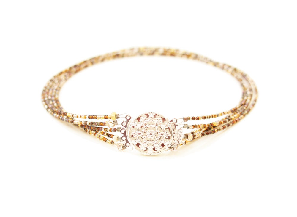 Golden brown short necklace with silver filigree clasp. Beaded czech rocailles multistrand choker.