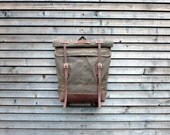 Waxed canvas rucksack/backpack with roll up top and waxed leather shoulderstrap,handle and leather bottem COLLECTION UNISEX