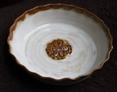 Handmade stoneware 9" pie plate with fluted edge in creamy white and sand brown, with a handcarved bee