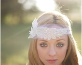 Intricately beaded feather headpiece with chiffon petals and tulle tie