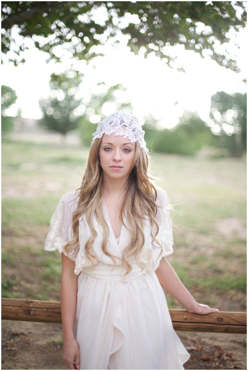 Ivory lace bridal cap with a bit of glistening detail