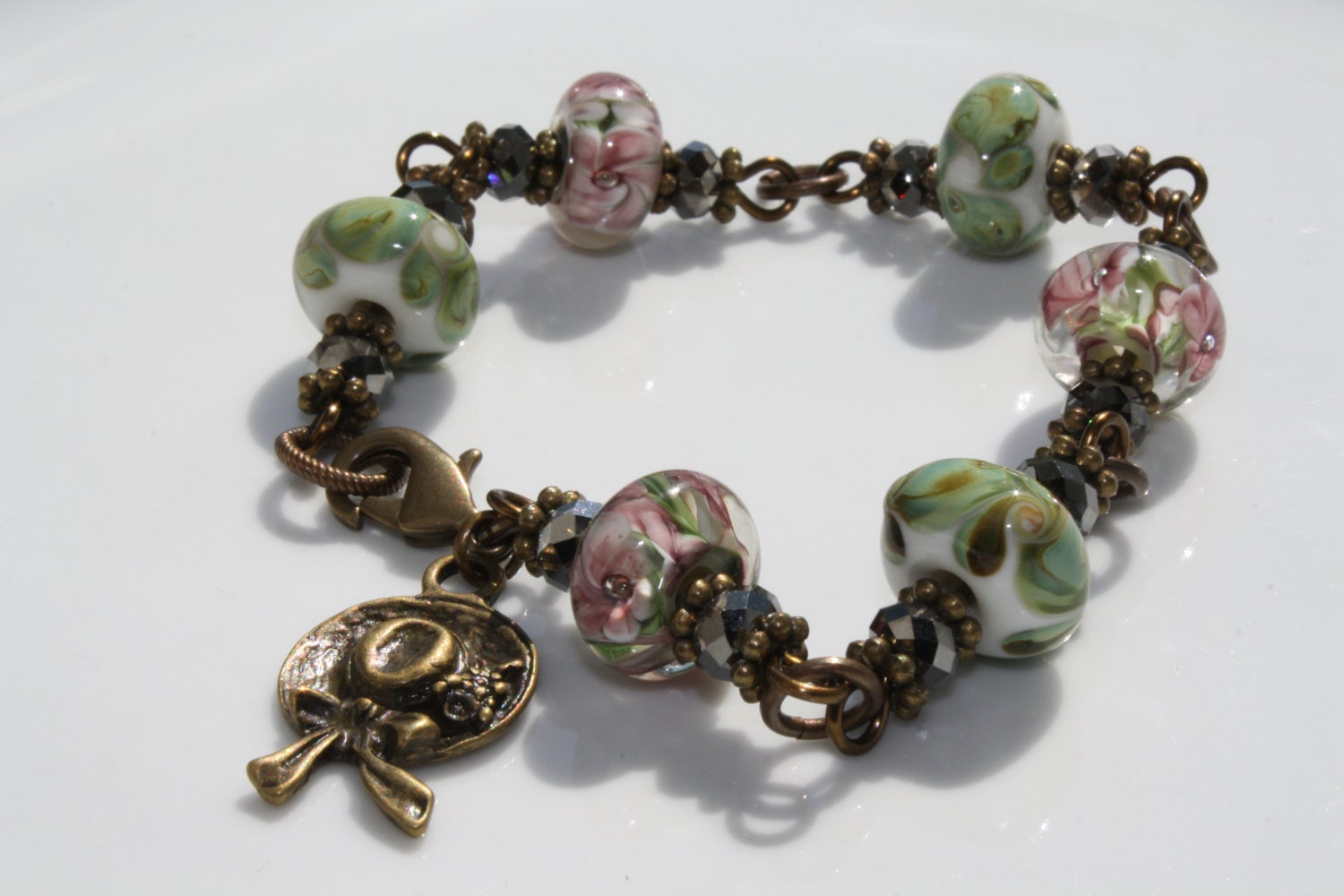 Lilac and Light Green Lampwork Glass Beaded Brass Vintage Style Bracelet with Hat/Bonnet Charm