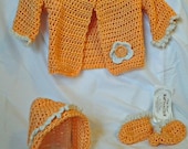 Soft peach baby girl set. cardigan, hat and booties