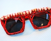 Human tooth decorated sunglasses