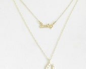 Itty Bitty CZ horseshoe and lucky charm layered necklace  with 14k gold filled chain.