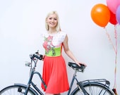 Fox on bike- neon orange dress