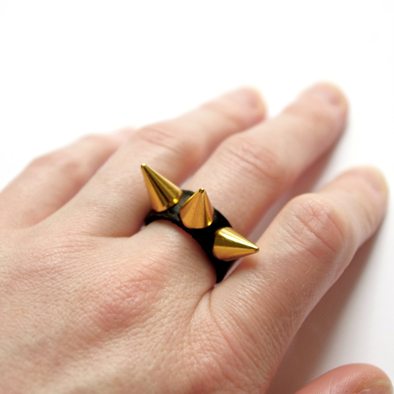 Skinny black leather ring with 3 golden spikes