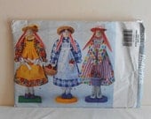 Dowel Bunnies in Three Different Dresses UNCUT Butterick 3876 Craft Sewing Pattern.