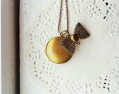miss coco round bow tie locket pendant necklace