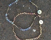 Blue Swarovski Aurora Borealis Crystal Necklace with Pyrite Stones and a Mother of Pearl Button