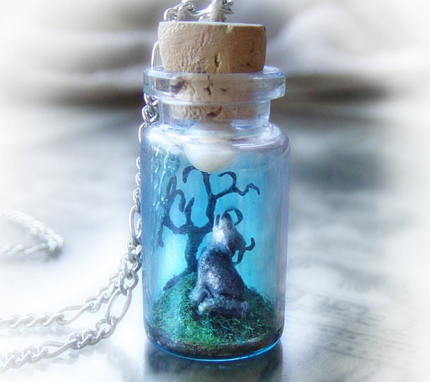 Wolf howling into the moonlight, clay scene bottle necklace