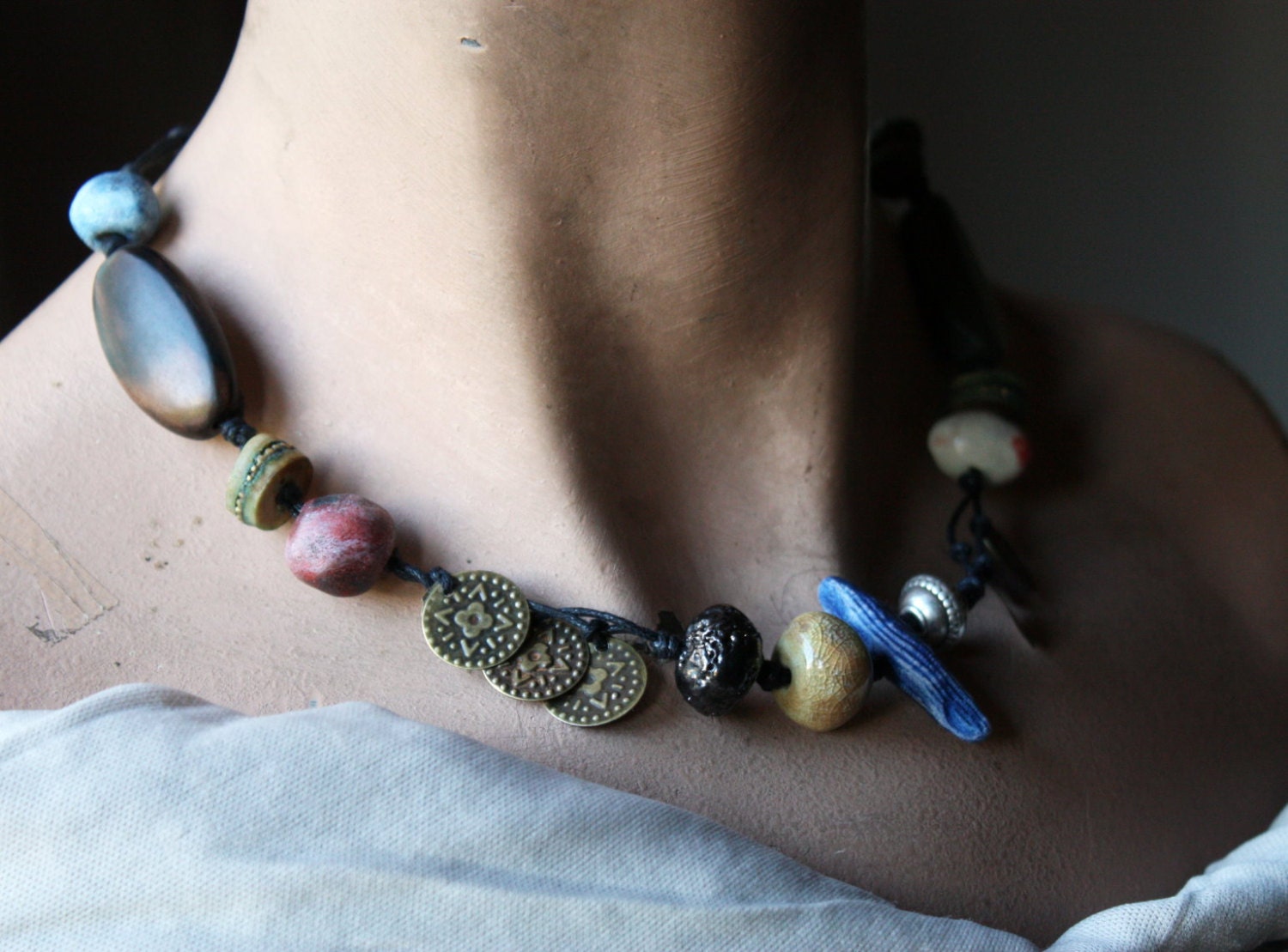 Matisse Blue, an Artisan Bead Necklace in bone, wood, stoneware, porcelain, and metal