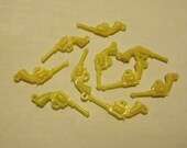 Destash of yellow plastic gun charms