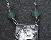 swimming fish necklace