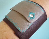 Secret Pocket leather cuff in eggplant with vintage buttons and hand stitching